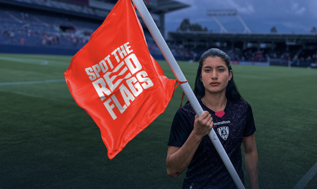 Women holding red flag