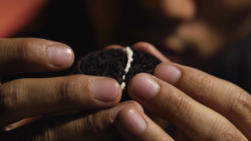User pasting oreo using cream gum